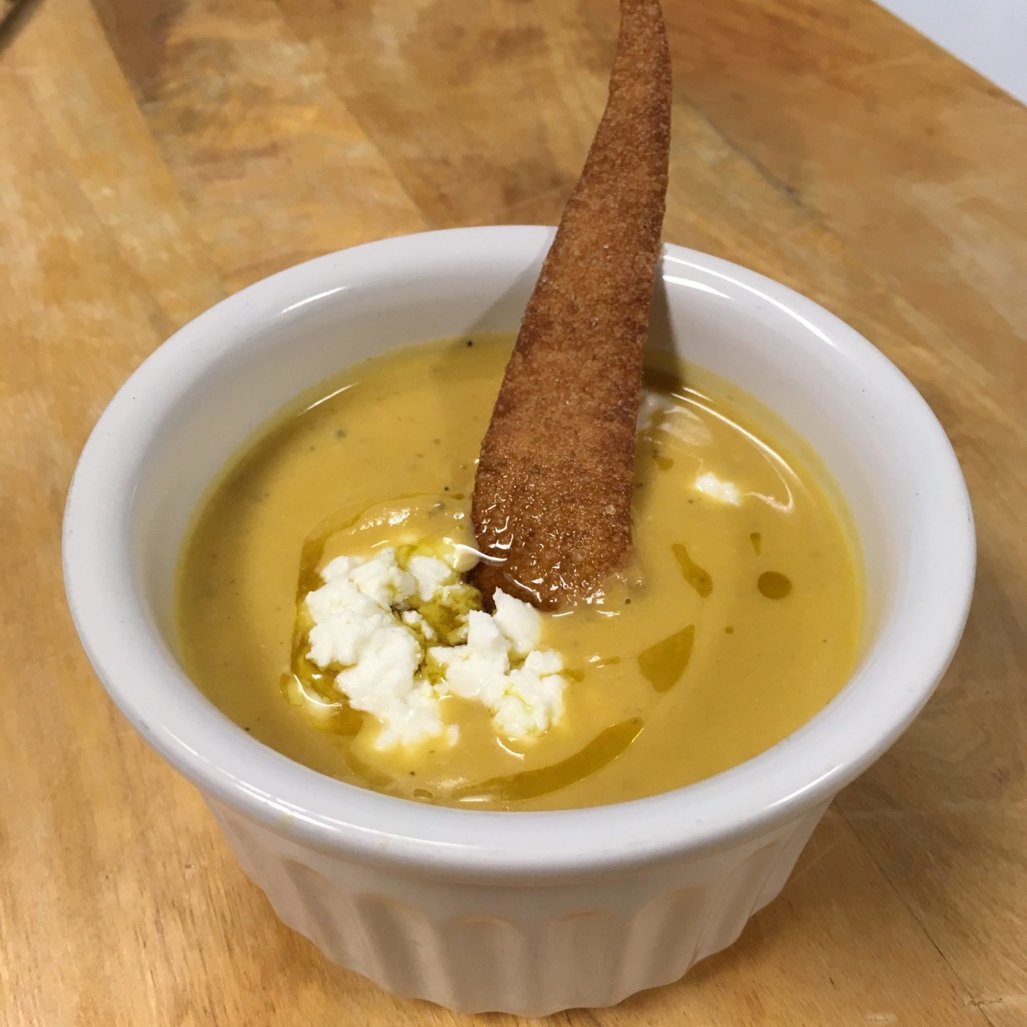 Butternut Squash Soup with Tuile, Goat Cheese, and Butternut Squash Seed Oil Drizzle
